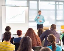 An image of a person giving a presentation.