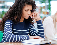 An image of a person reading a book.